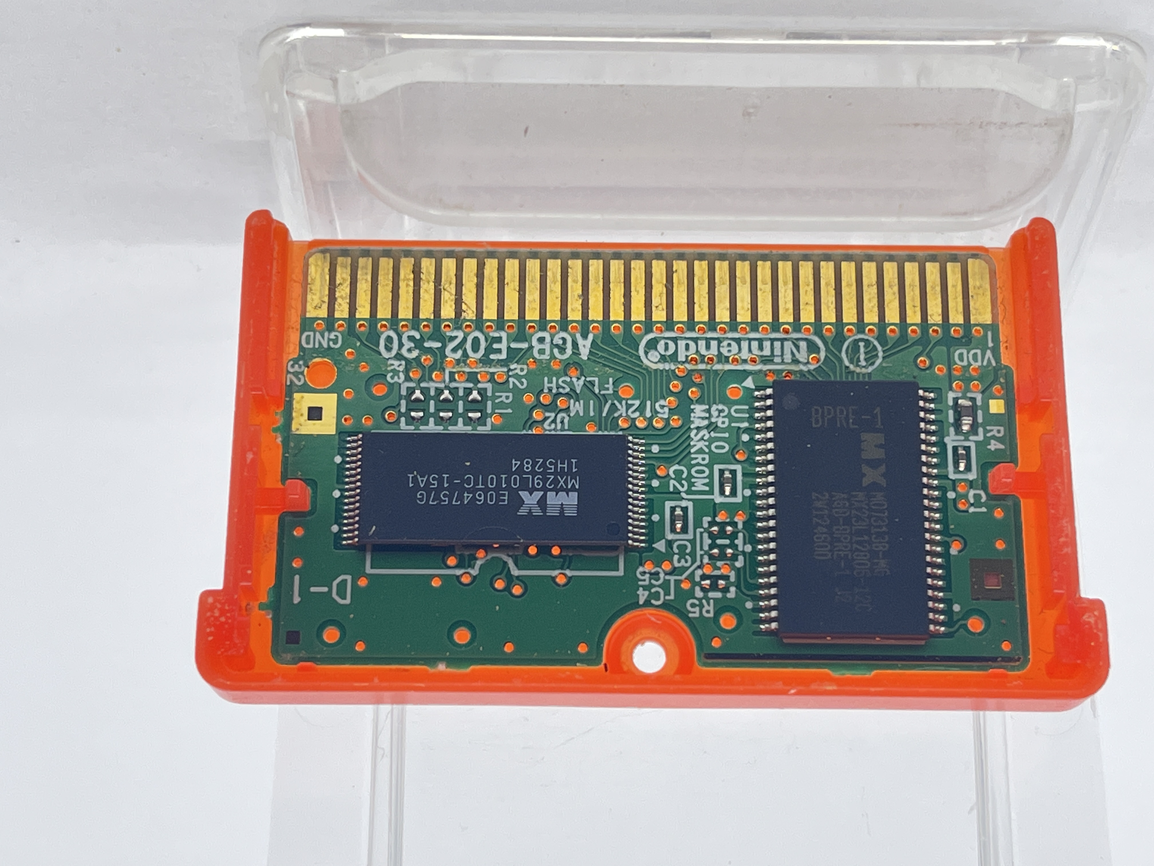 The 32 gold plated connector pins on Fire Red